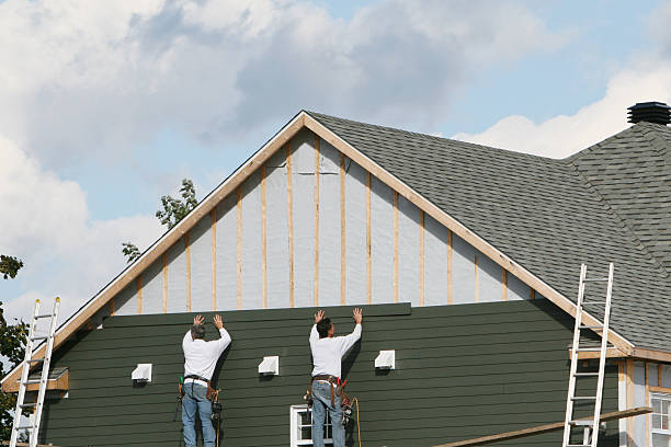 Professional Storm Damage Siding Repair technician working in Woodville, FL
